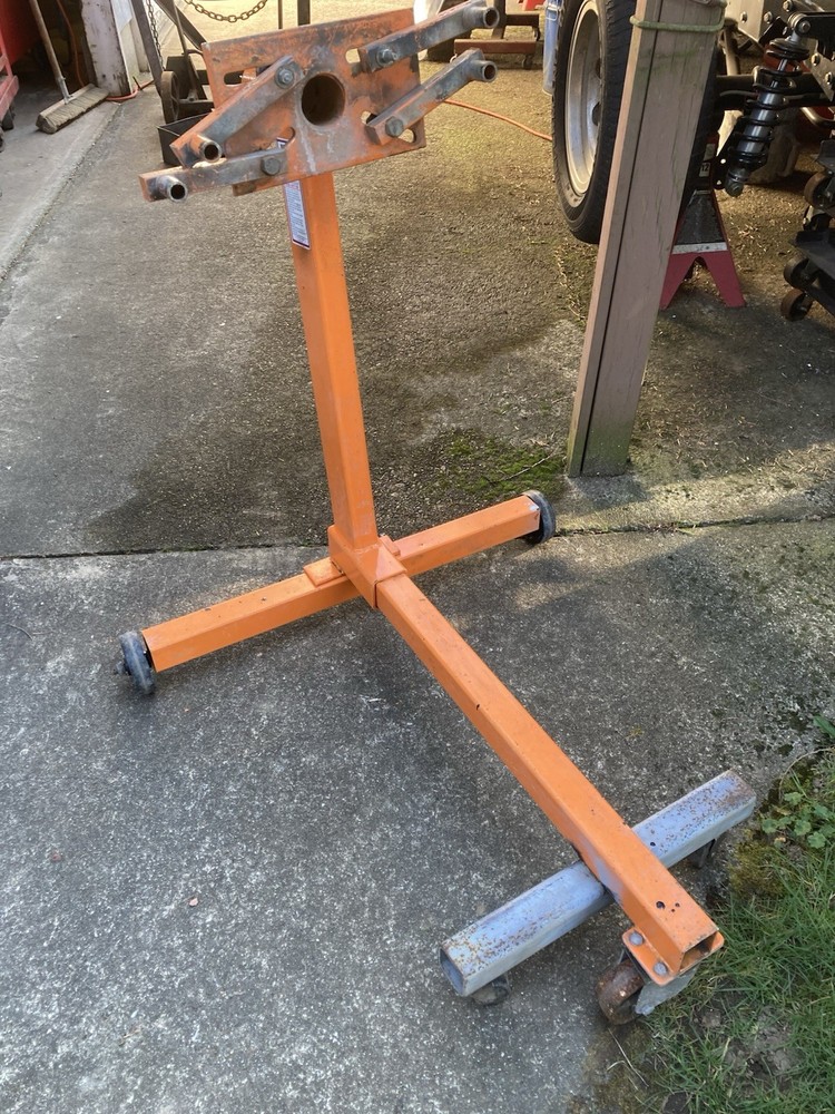 Engine Rebuild Stand Modified for Greater Stability with additional Wheels.