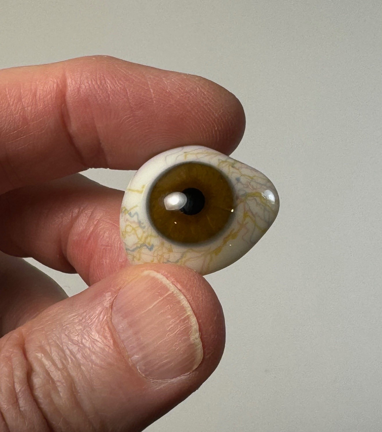 Antique German hand-blown human prosthetic glass eye.  Bloodshot eye. Brown.