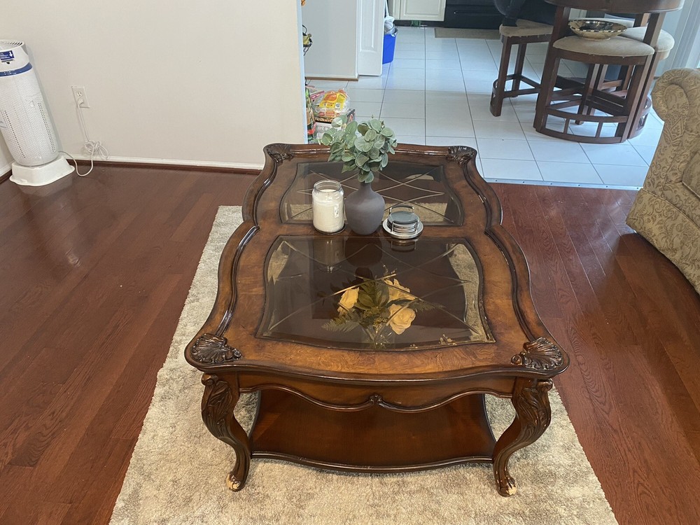 A Set Of Beige Sofas And A Coffee Table