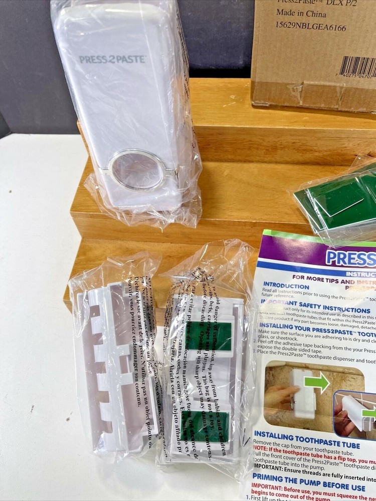NOS RC Press to Paste -toothbrush holder and toothpaste dispenser
