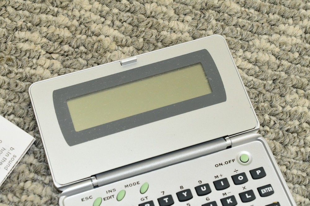 Generic Electronic Language Translator Handheld Computer - Needs New Batteries