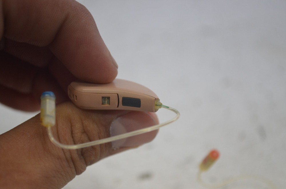 Resound Hearing Aids as is not tested missing button , might affect function