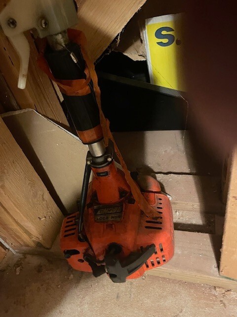landscaping equipment-weed whacker and chain saw