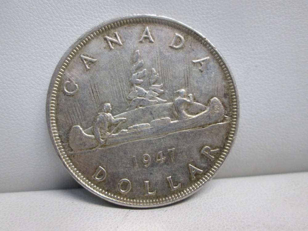 1947 CANADIAN SILVER DOLLAR- HIGHER GRADE- POINTED 7