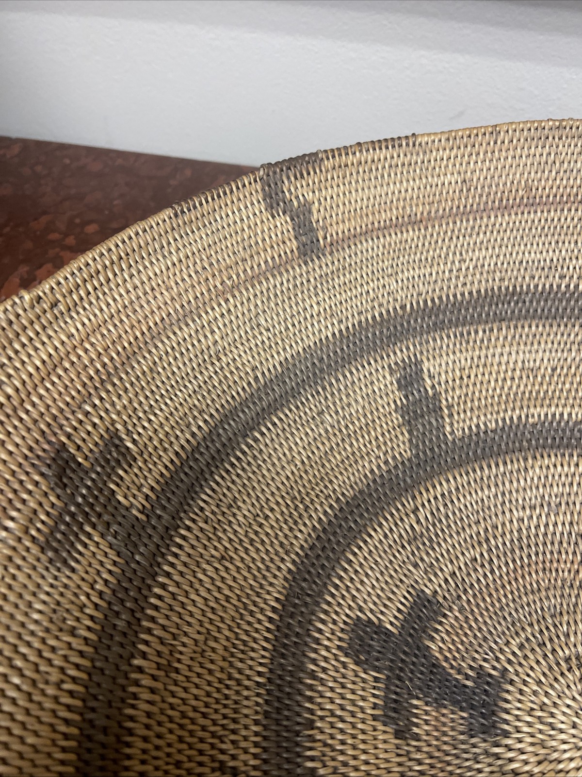 Woven Apache pictorial 17 1/4” basket with geometric and symbolic designs.