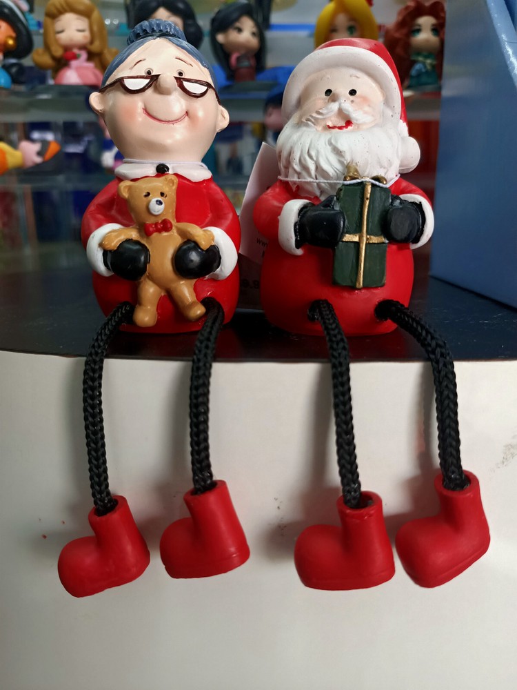 Santa and Mrs Santa sitting figures.