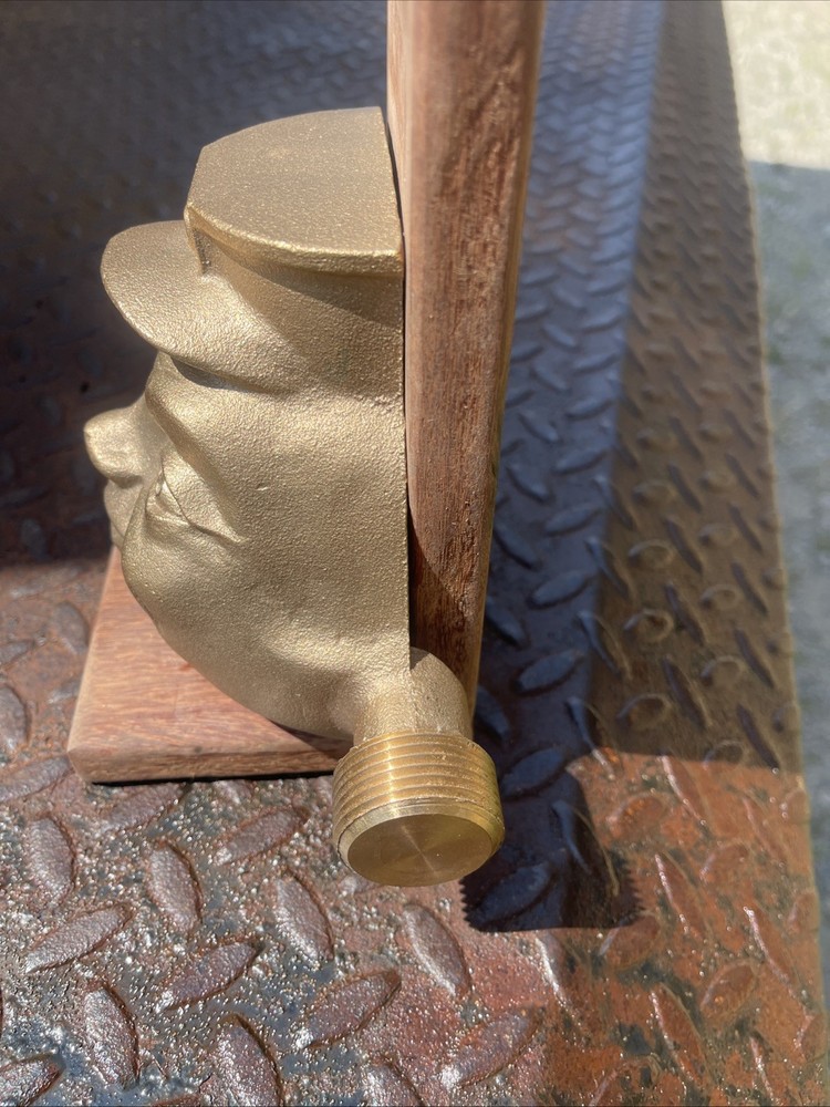 Brass award trophy mans face FORD hat