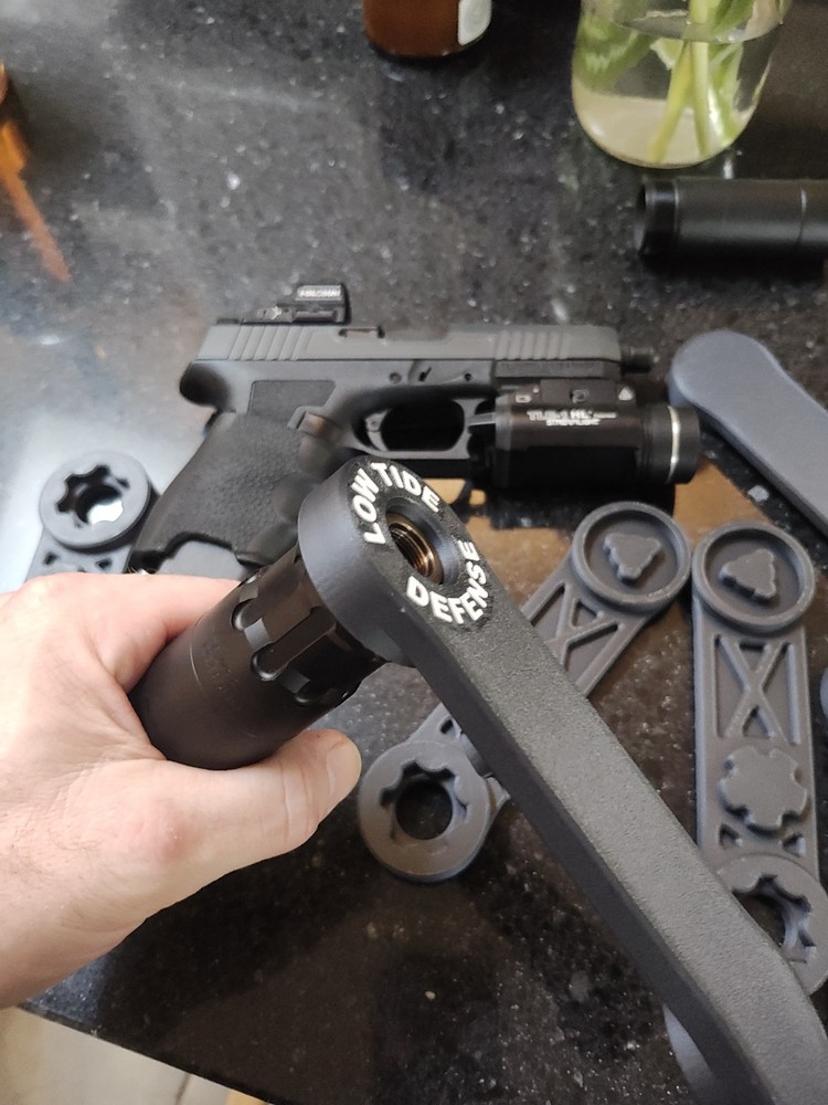 Rugged obsidian 9/45 suppressor tool.