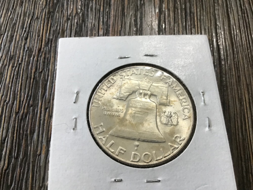1953 s silver Franklin half dollar.