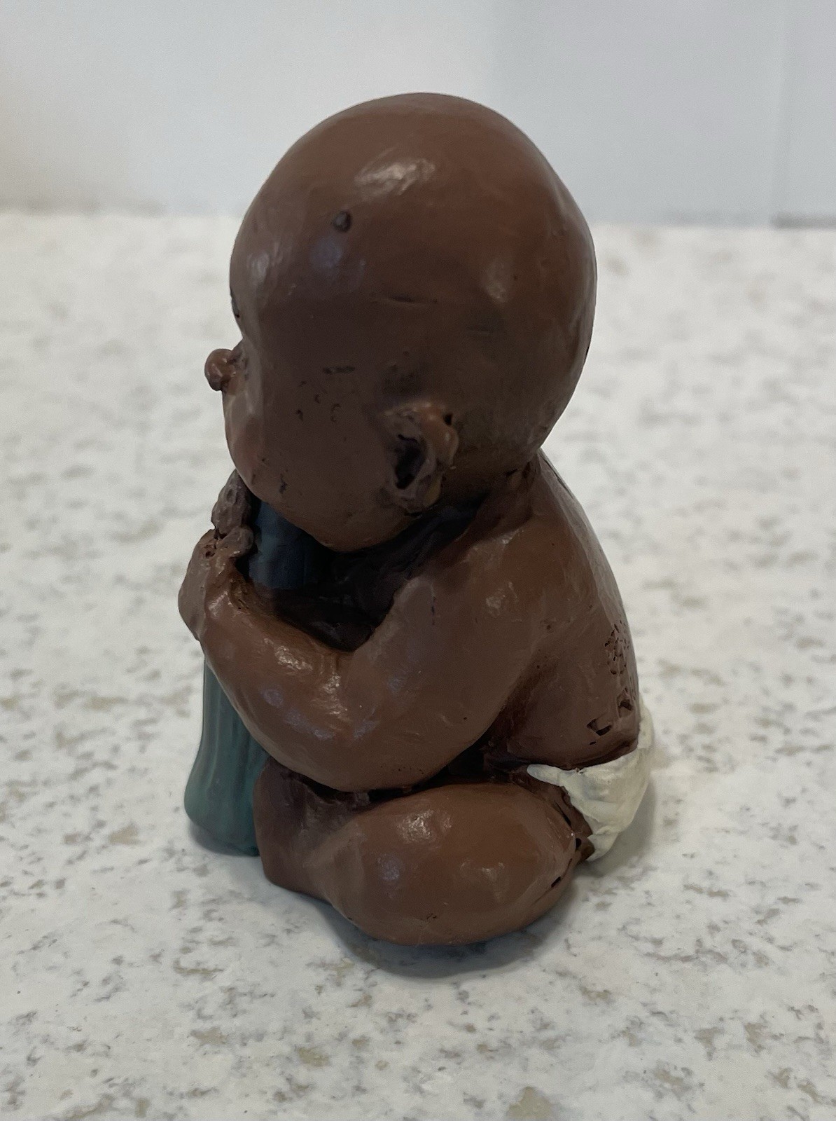 Baby With Coke Bottle 2 1/2” Tall Handcrafted, Signed Figurine