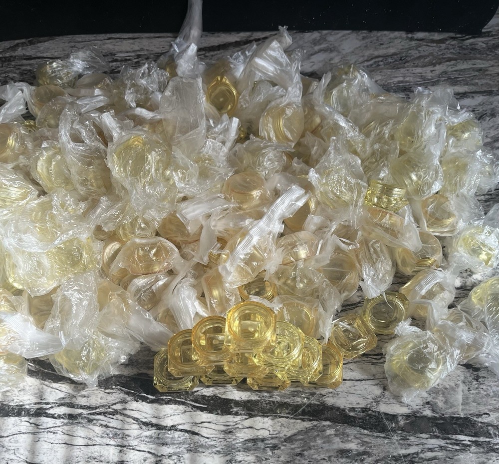 Yellow refillable diamond shaped bottles