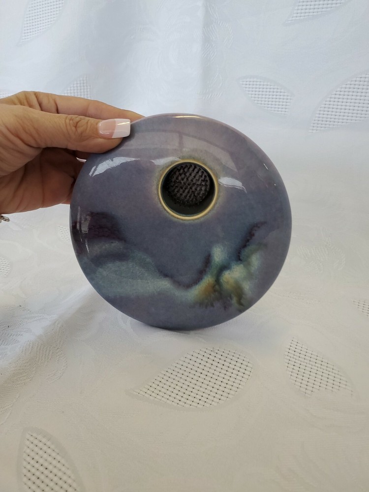 Ceramic single flower bud display vase.