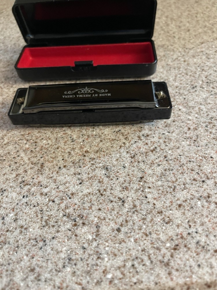Neuma 10-Hole Blues Harmonica in a protective case