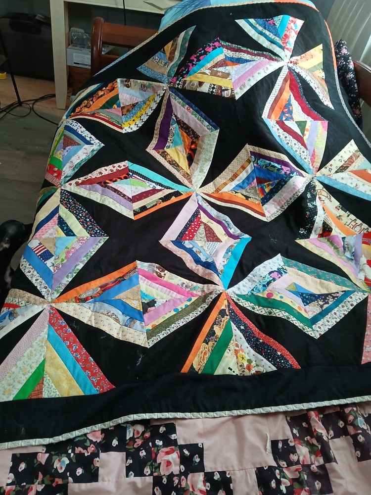 handmade strip quilt black background