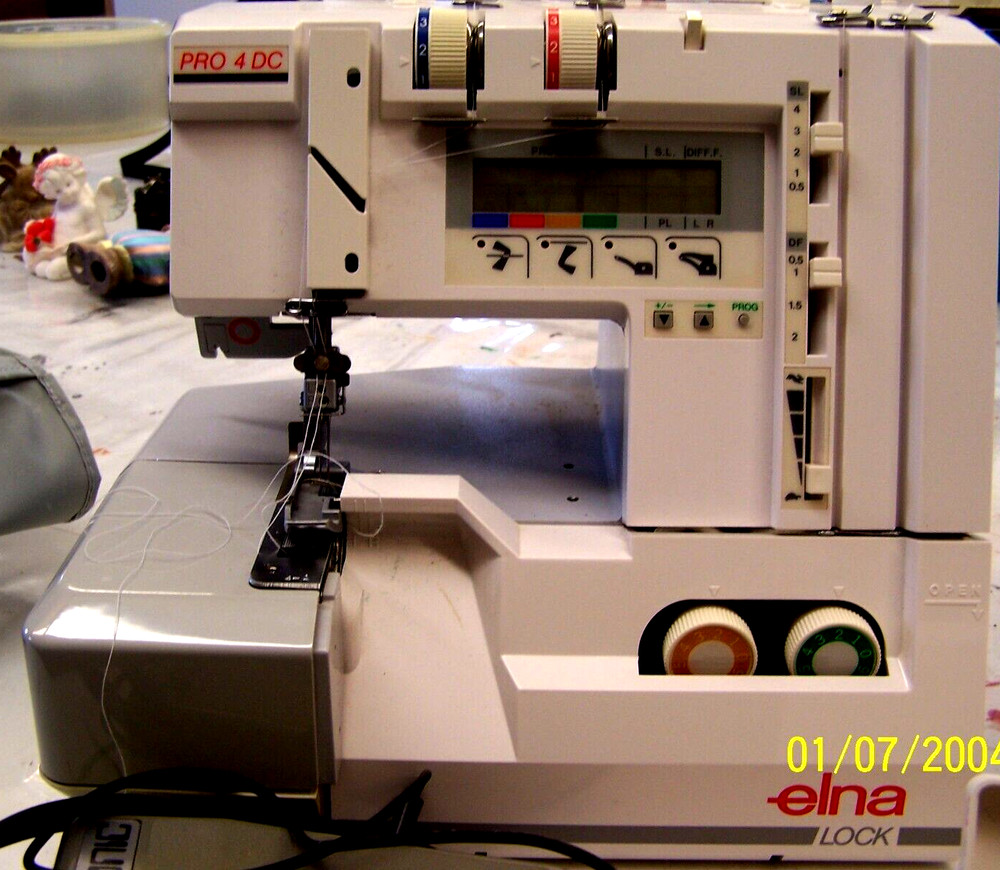 used Elna Lock Pro 4 DC Overlock Serger Machine plus Accessories powers up