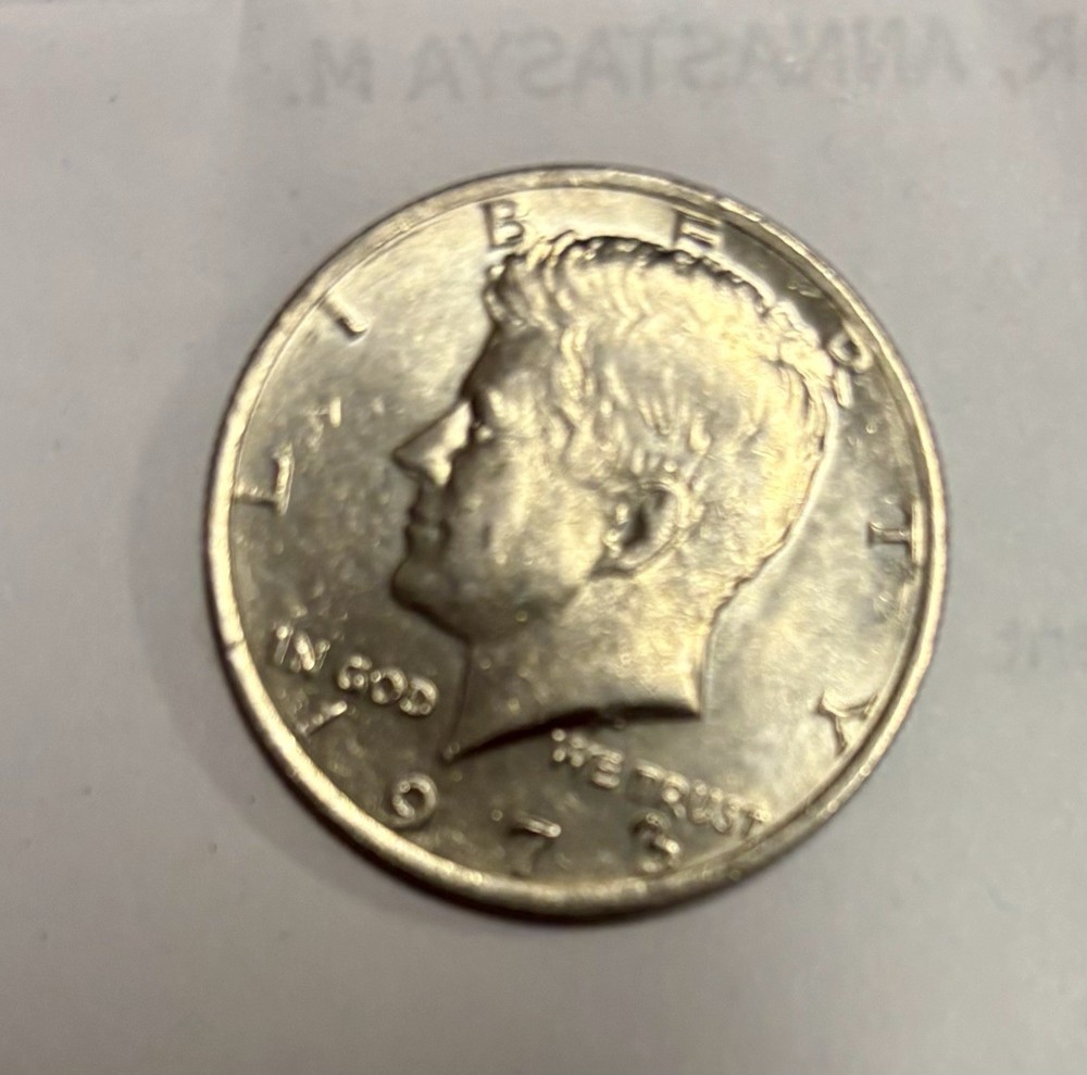 1973 Kennedy Half Dollar With No Mint Mark, Error On E