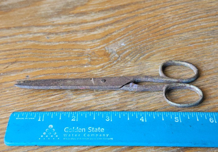 SCISSORS MADE IN GERMANY. RED PAINT HANDLE. NEEDS CLEANING. METAL