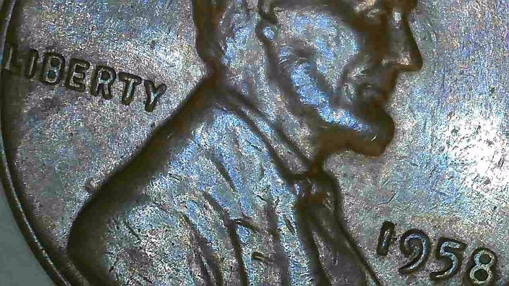 1958 P lincoln penny with 2 cuds errors on reverse wheats.