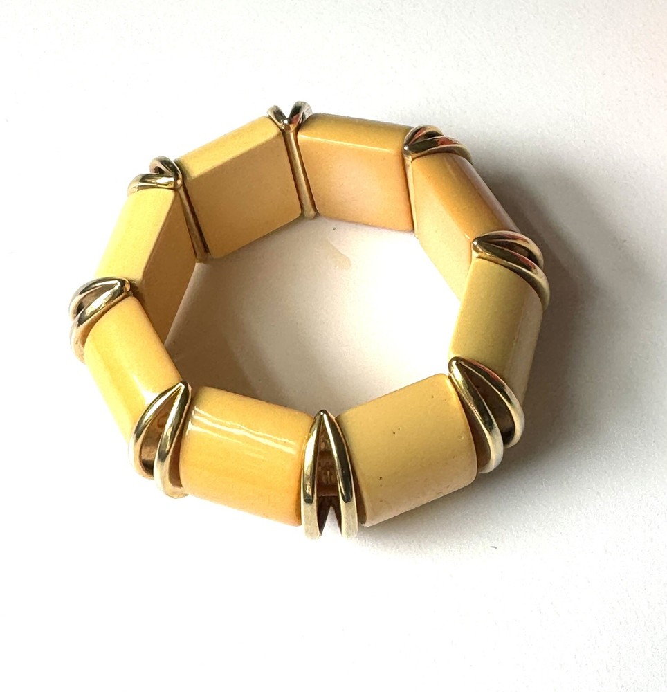 Nice butterscotch bakelite expandable bracelet with deco gold inserts