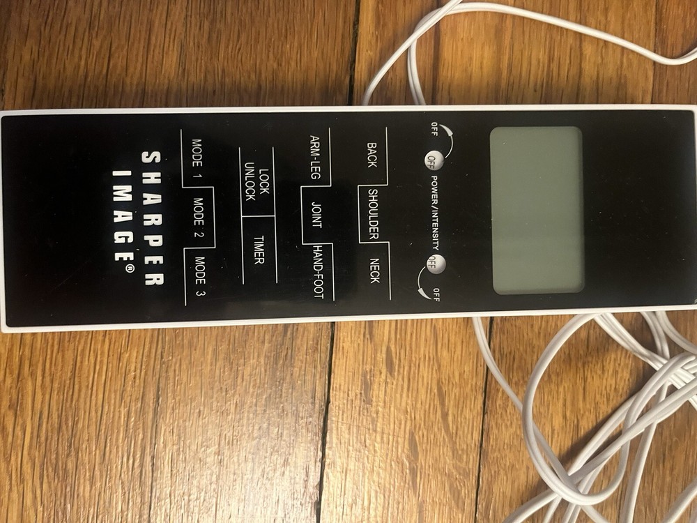 Sharper image tens massager with handheld control plus extra pads