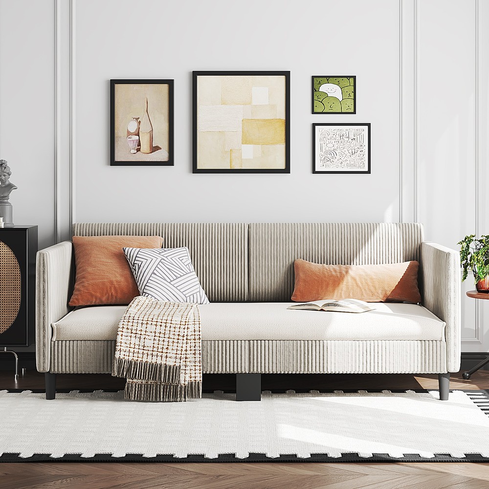 Double corduroy upholstered sofa bed with buttoned backrest and sturdy armrests,