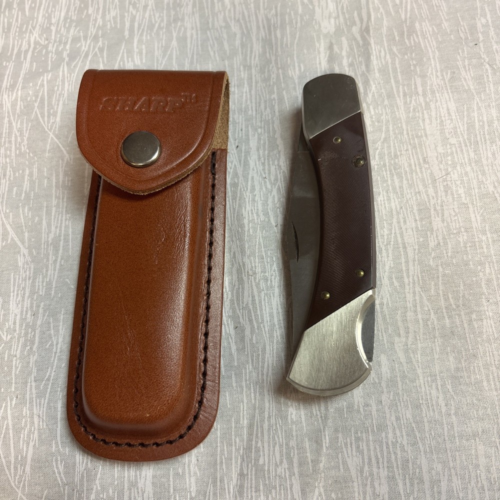 SHARP SABRE U.S.A Kinfe With Leather Covering.