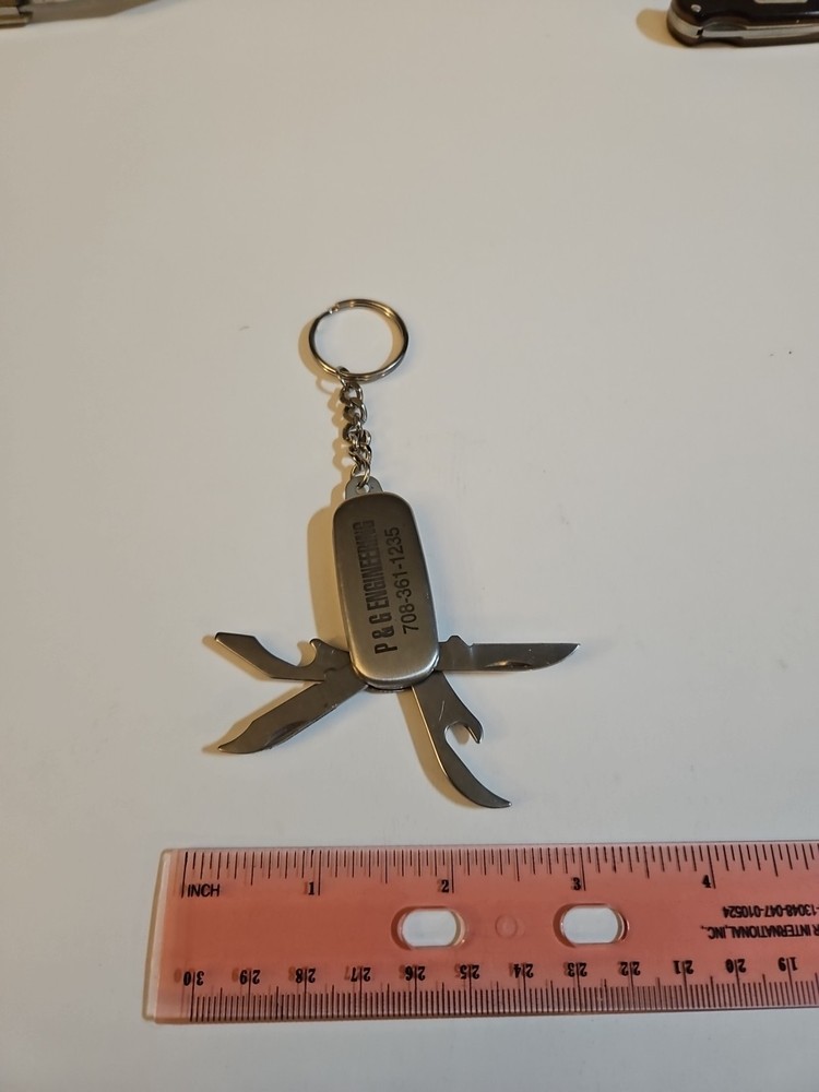 multi tool key chain stainless steel With P&G engineering On It.