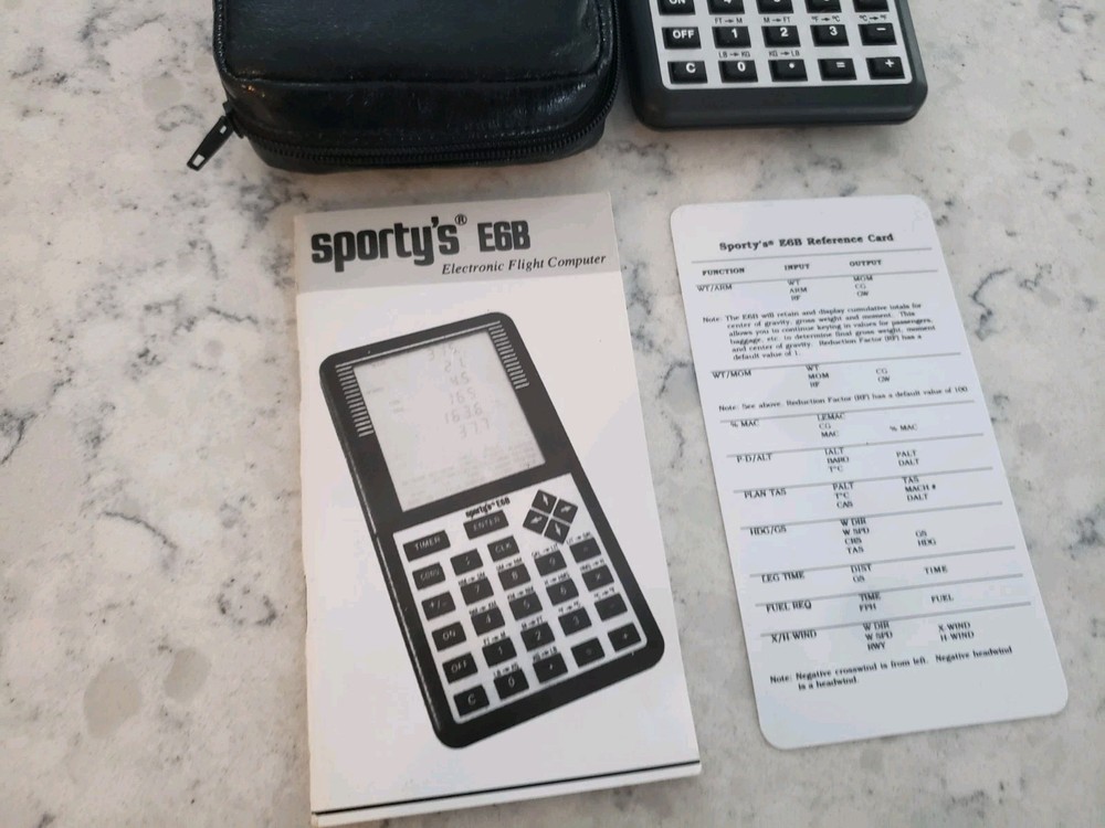 Sporty’s E6B electronic flight computer and Aviation slide computers plates