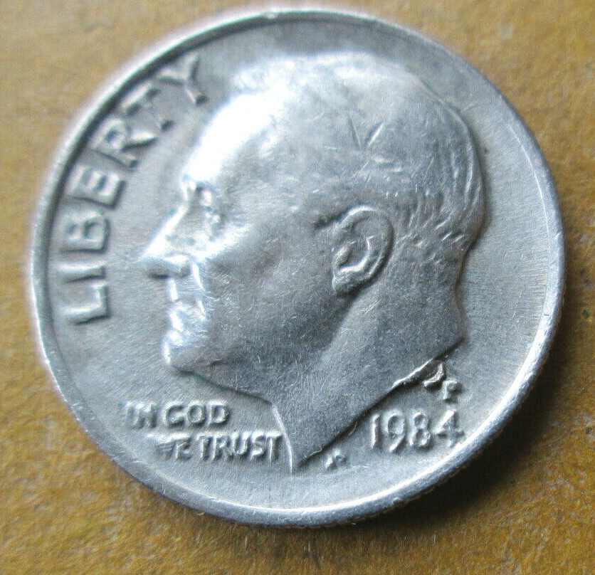 1984-P ROOSEVELT, OBVERSE INTERIOR DIE BREAK (IDB) ERROR @ MINT MARK, VF, CIRC.