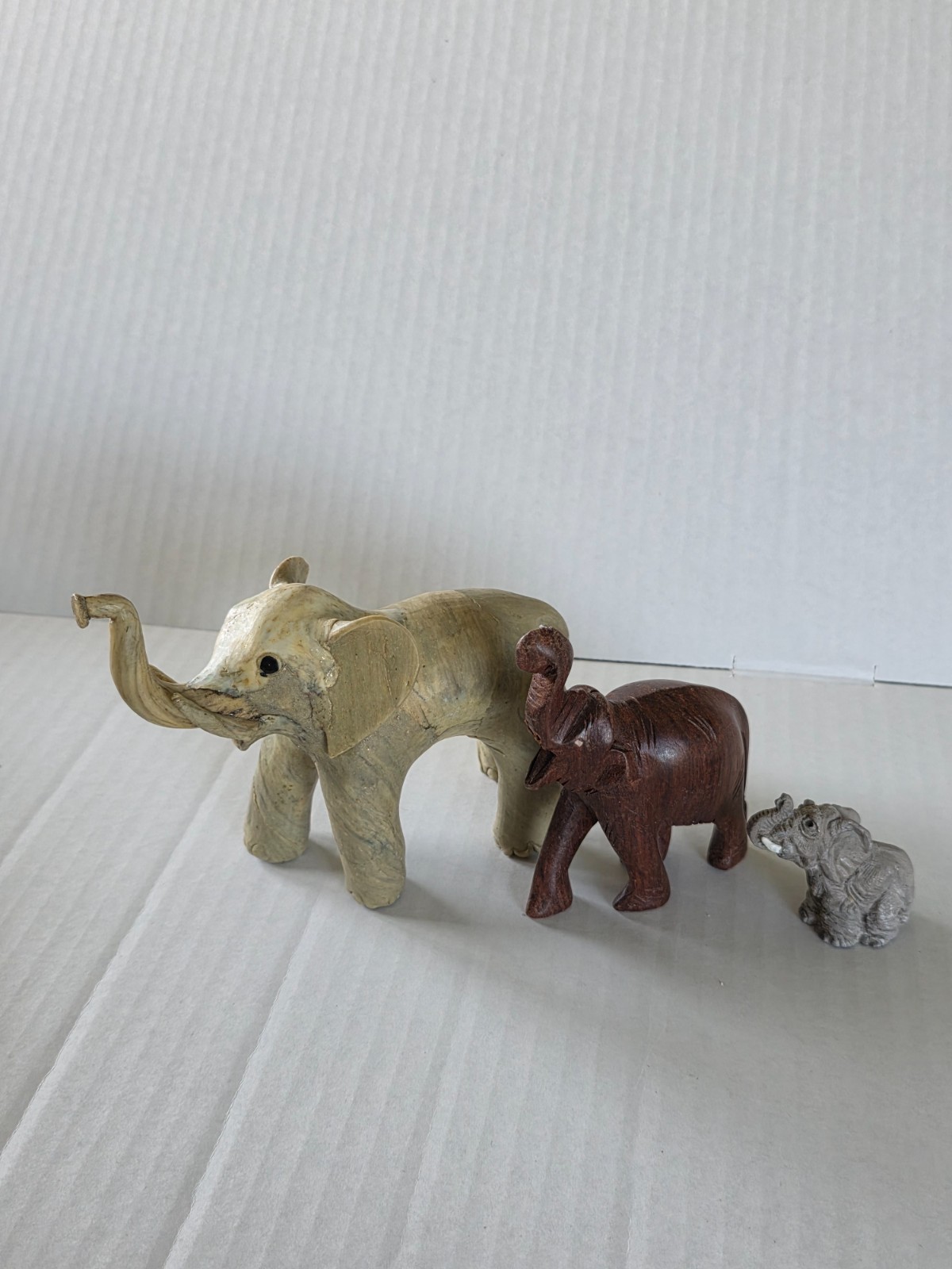 Three elephant figurines