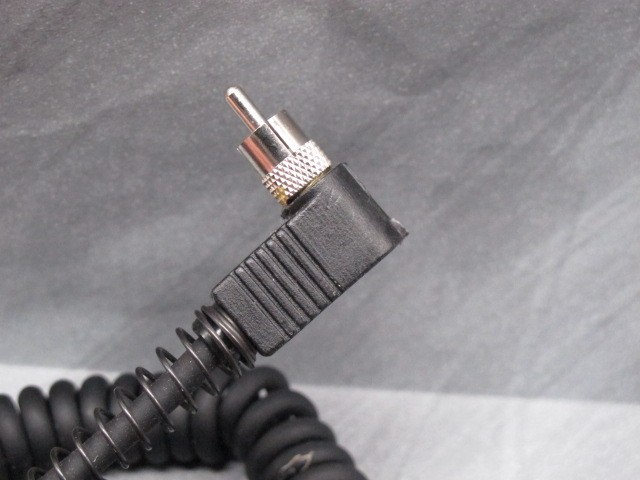 SunPak CV-1 with coiled cord and right angle RCA type plug
