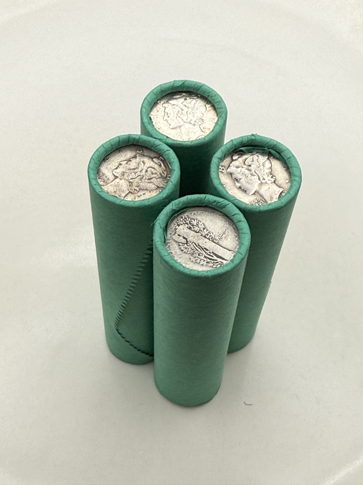 SILVER MERCURY DIME showing on old vintage unsearched green wheat penny roll us