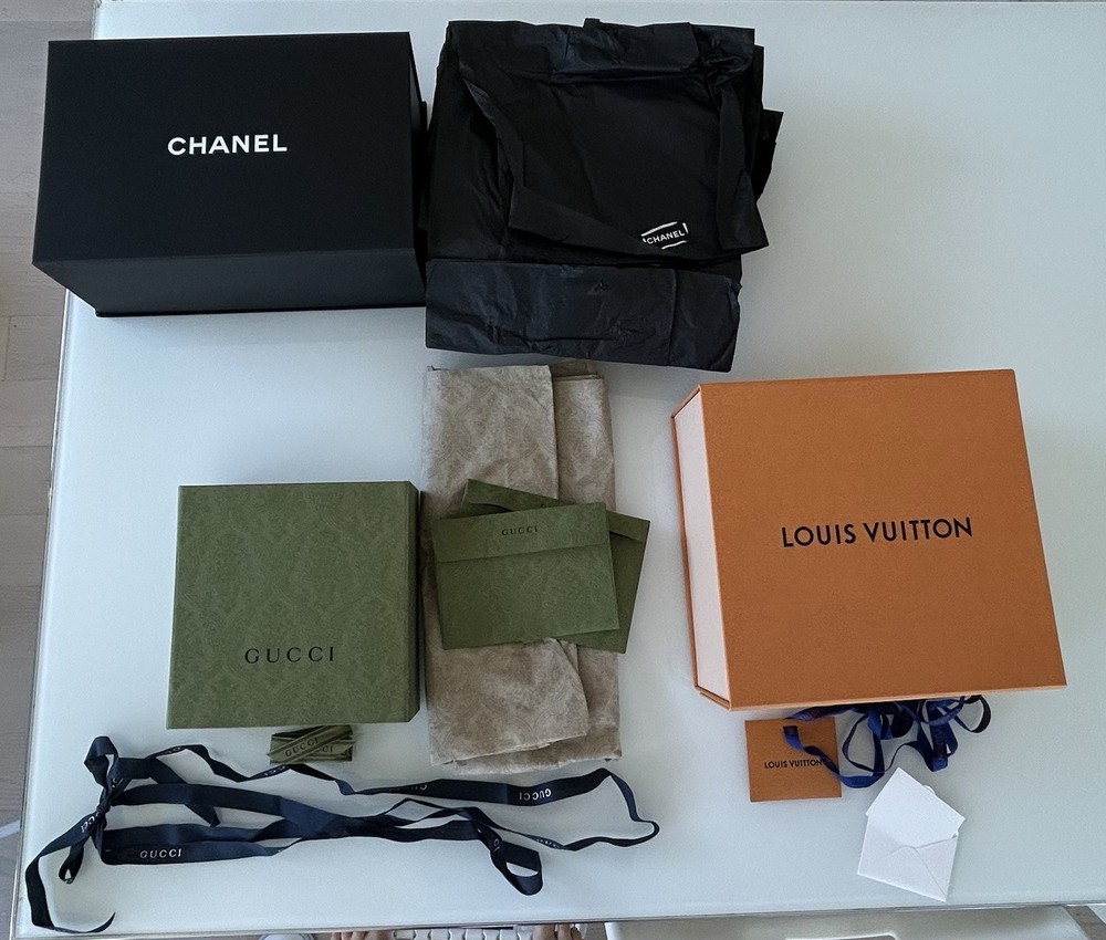 empty designer boxes - Chanel, Gucci, And Louis Vuitton. Various sizes