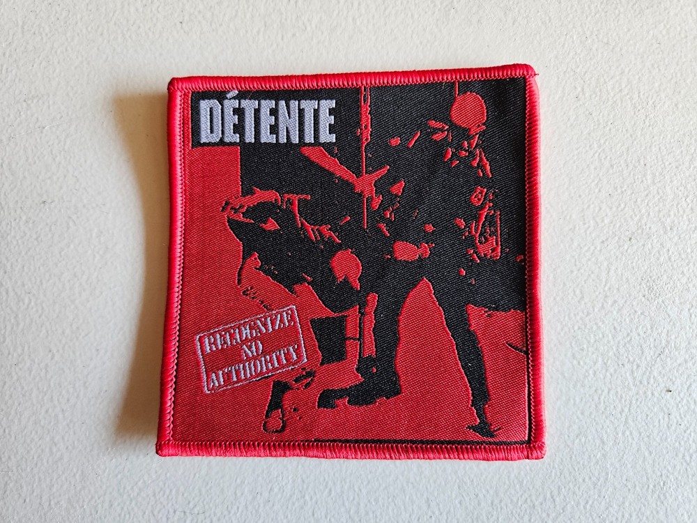 DETENTE, RECOGNIZE NO AUTHORITY, SEW ON RED BORDER, WOVEN PATCH