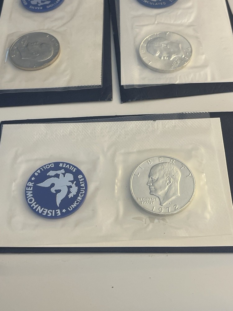 1972, 1973, 1974 Eisenhower 40% Silver Dollars Blue Envelopes, Uncirculated