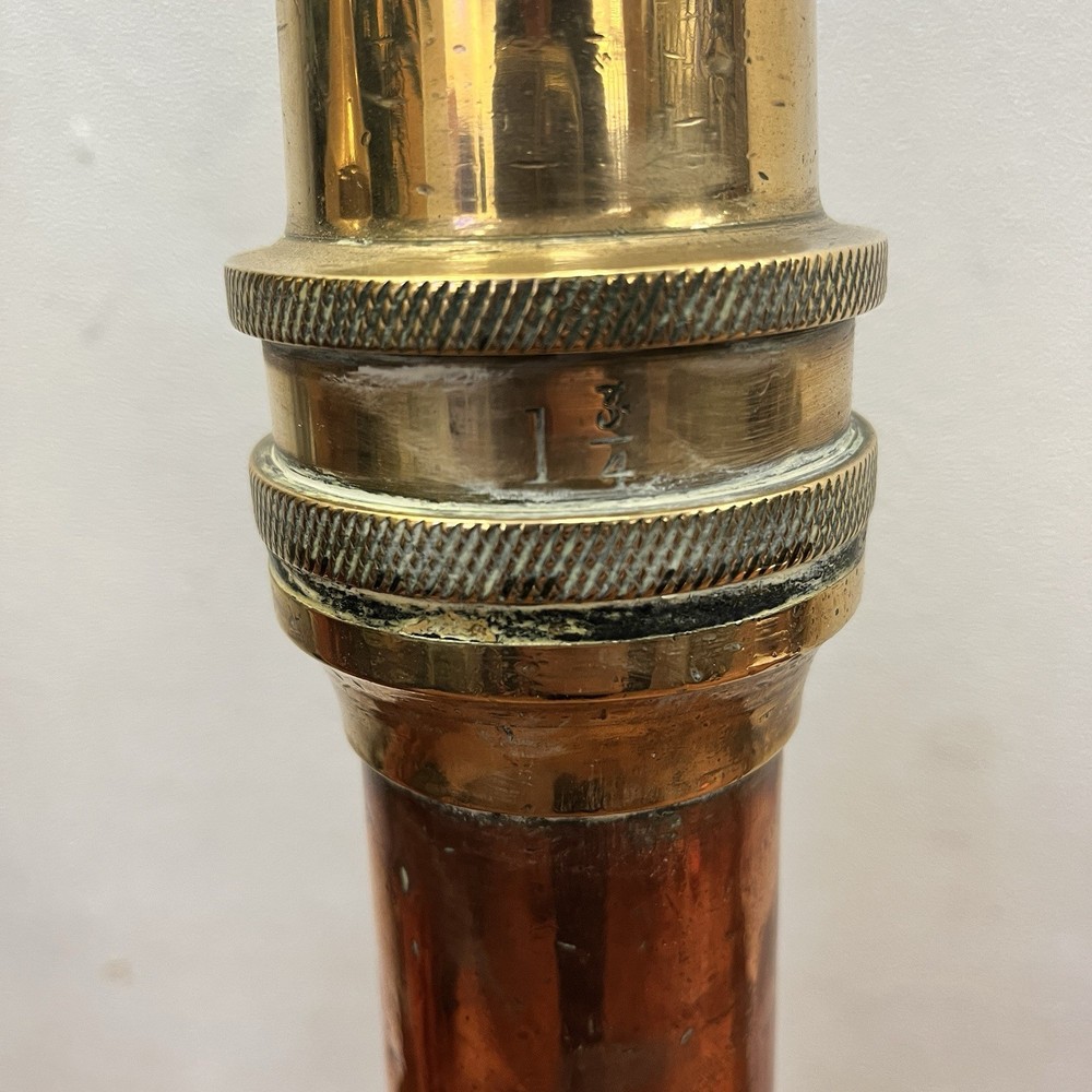 Antique brass and copper fire hose nozzles