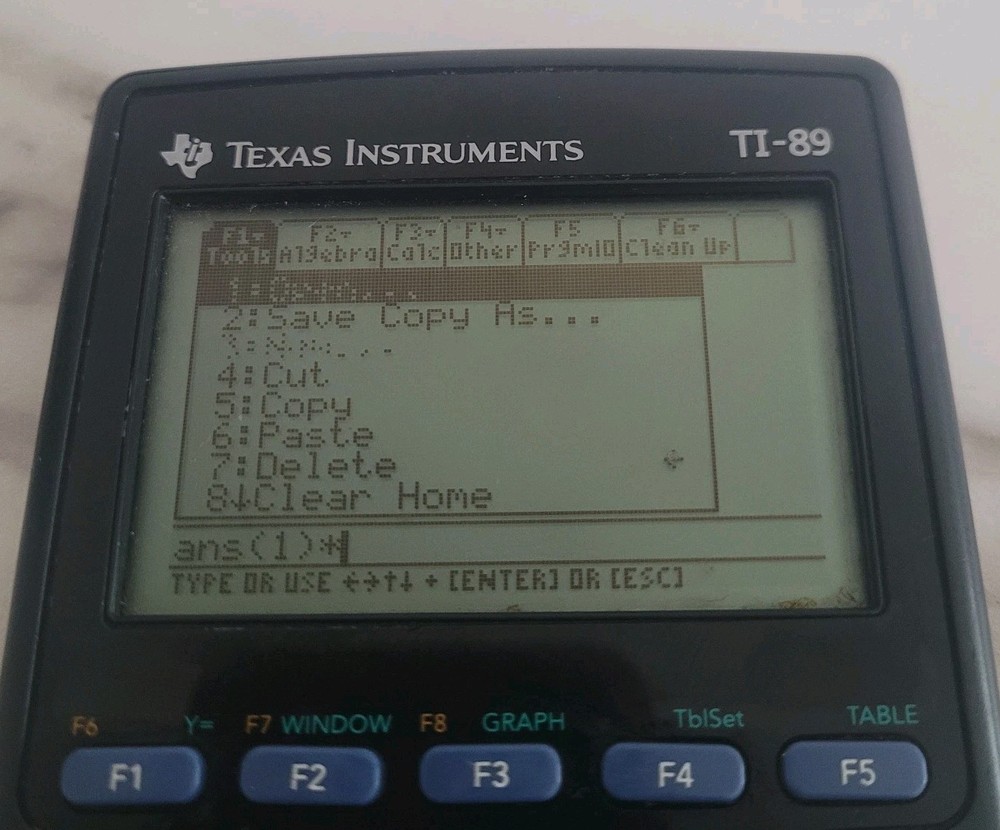 Texas Instruments TI-89 Calculator, powers on, Unknown if fully functional