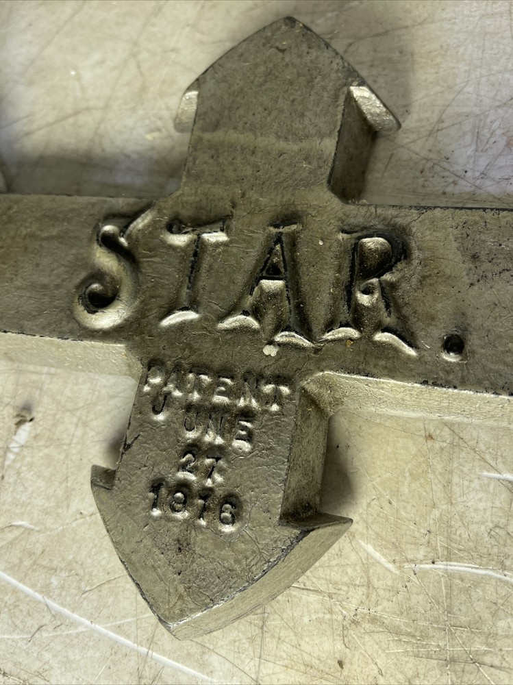 Antique Cast Iron Rotating Star Unknown Tool