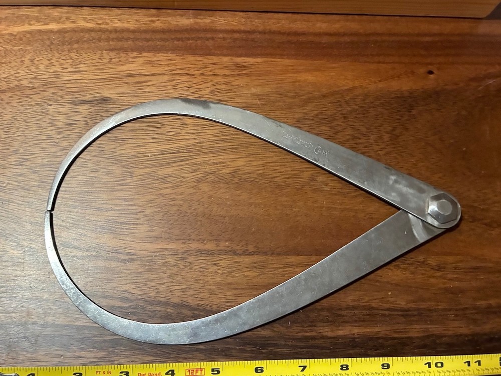 Vintage large metal caliper outside