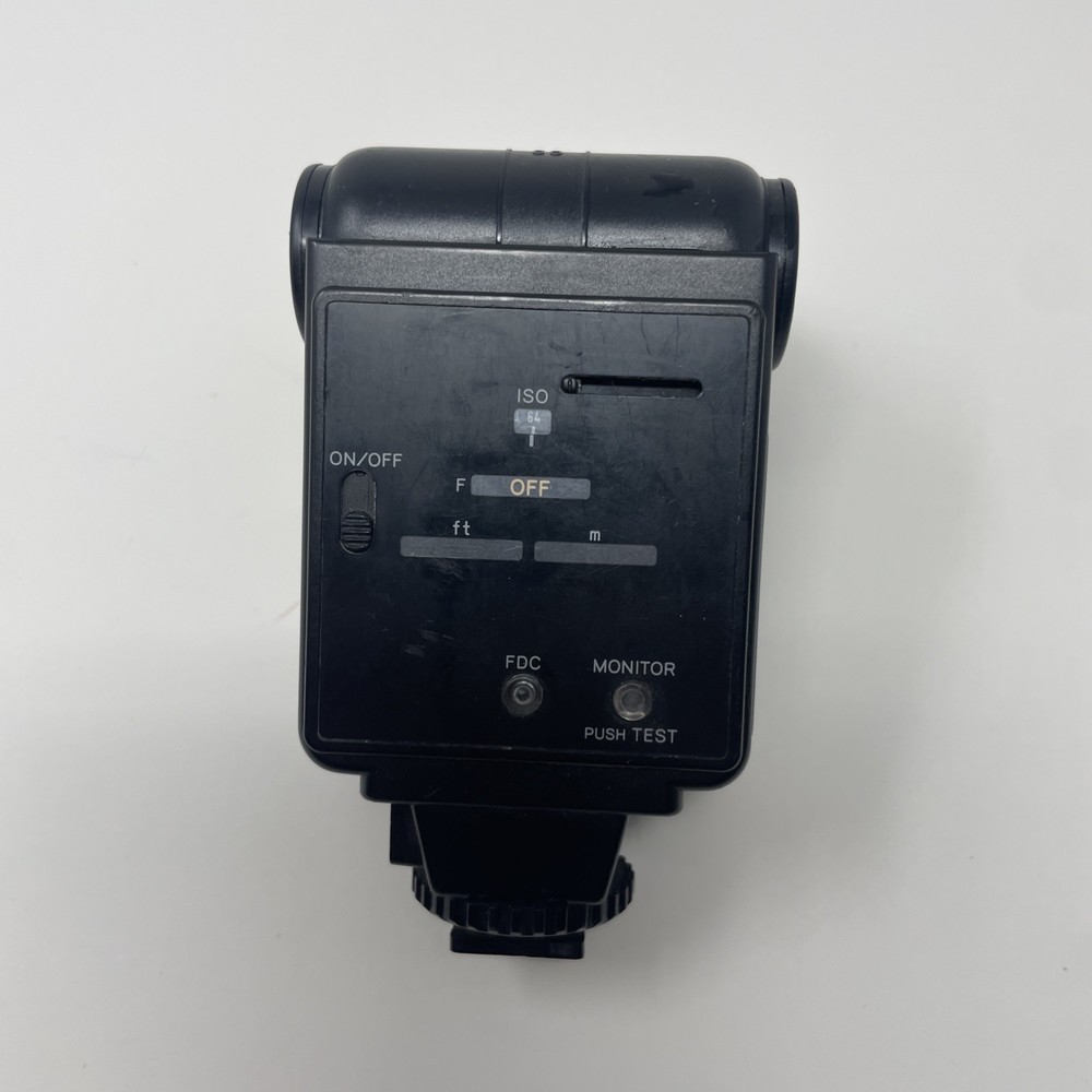 Minolta Auto 220X Universal Shoe Mount Camera Flash With Plastic Cover