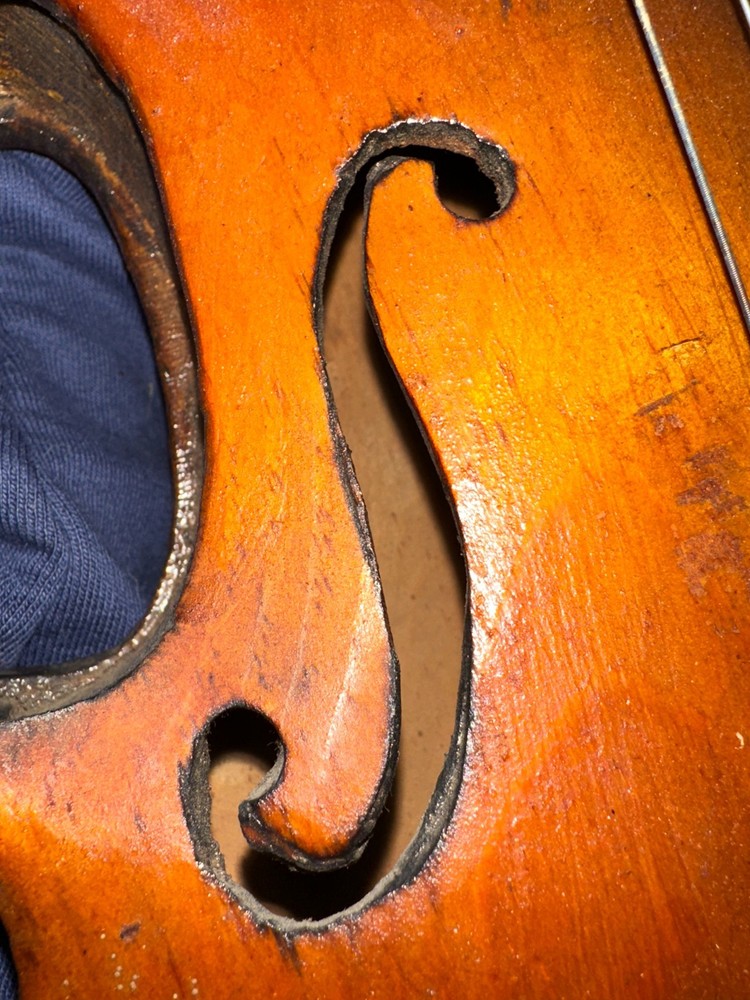 Antique violin and wooden coffin case