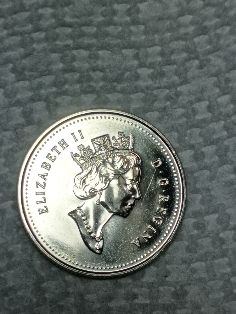 Canada 1999 error Twenty five cent mule coin scarce coin missing 25 cent