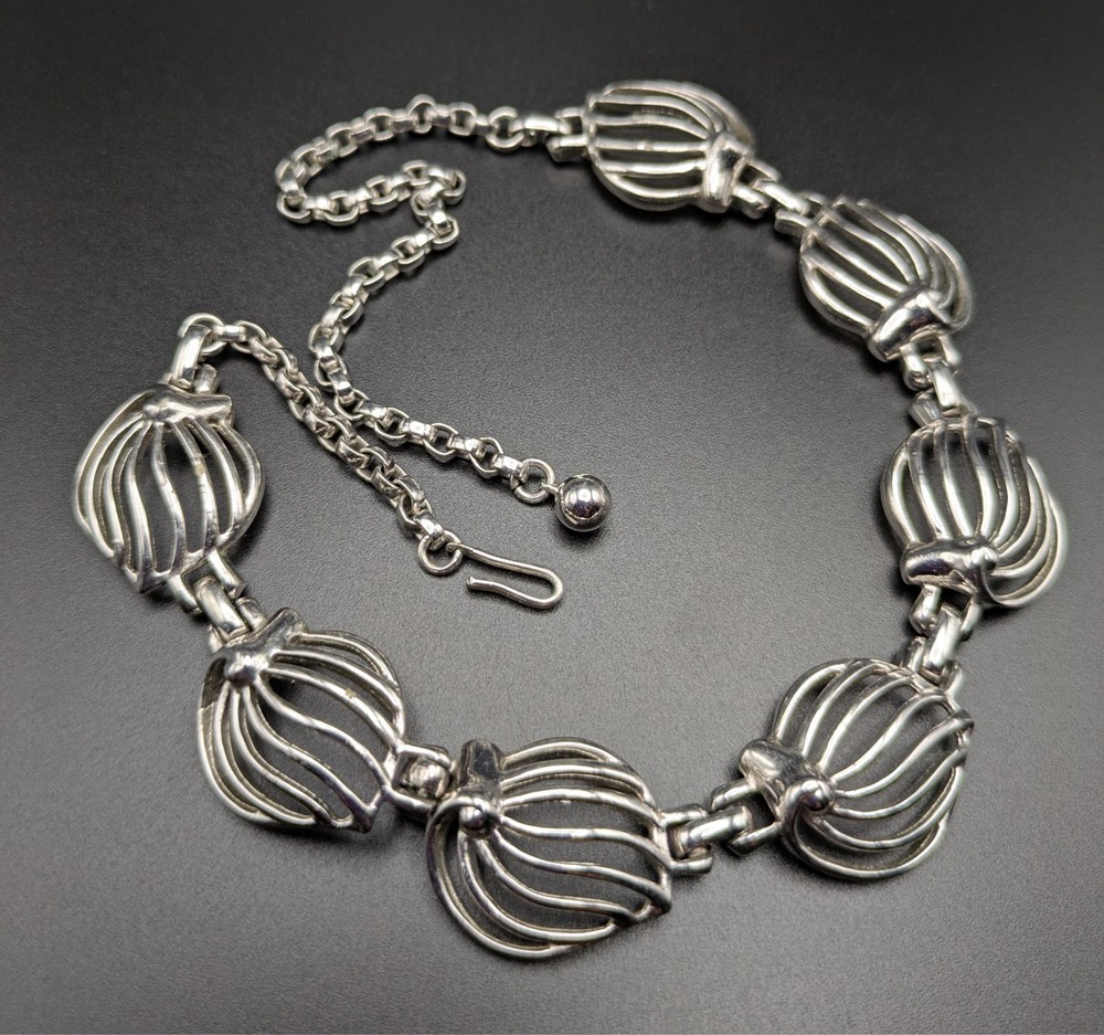 Silver-Toned Bracelet and Necklace Set Featuring Abstract Leaf Patterns