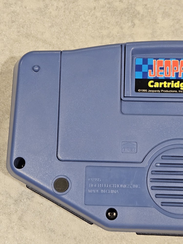 Tiger Electronics Jeopardy Hand Held Game 1995 with Answer Question Book