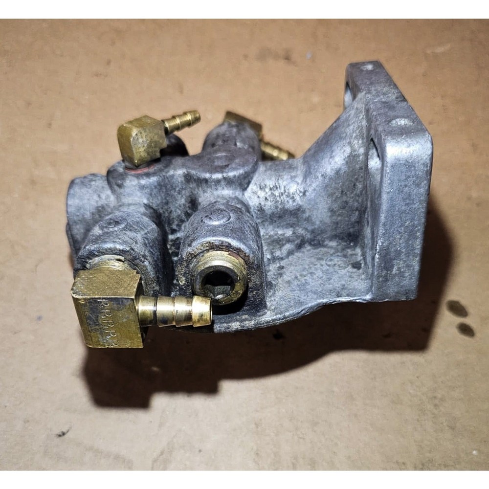 Fuel filter base, 4x 3/8 FNPT barb threads. (324)