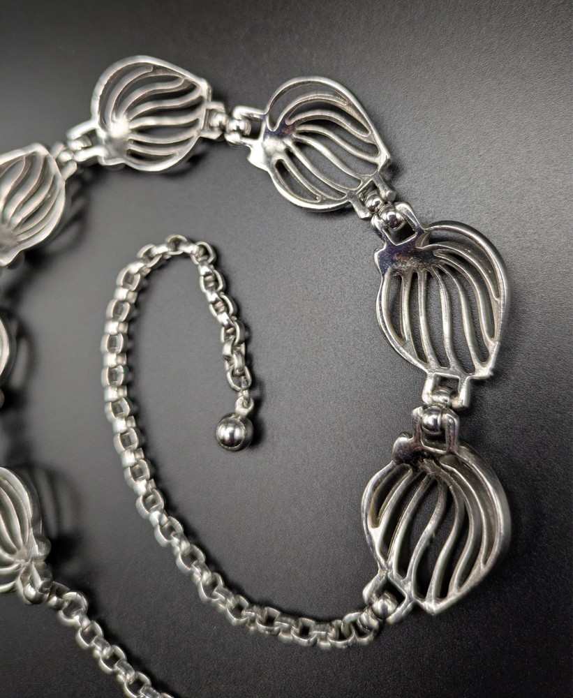 Silver-Toned Bracelet and Necklace Set Featuring Abstract Leaf Patterns