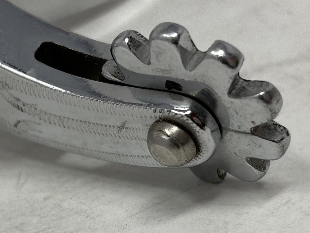 Silver Rodeo Spurs with Leather Straps and Rowels