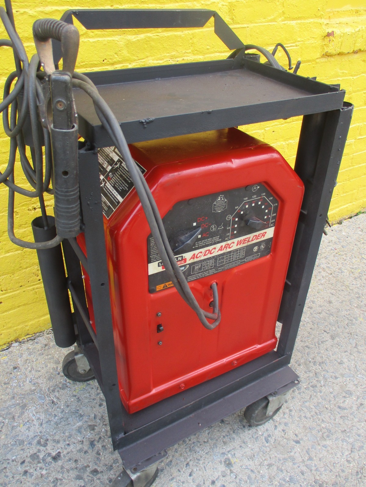 LINCOLN AC/DC 225 ARC WELDER on CART w/25ft  of CABLES