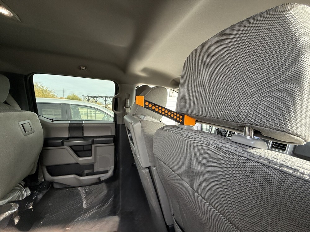 Headrest bow hanger with rubber insert