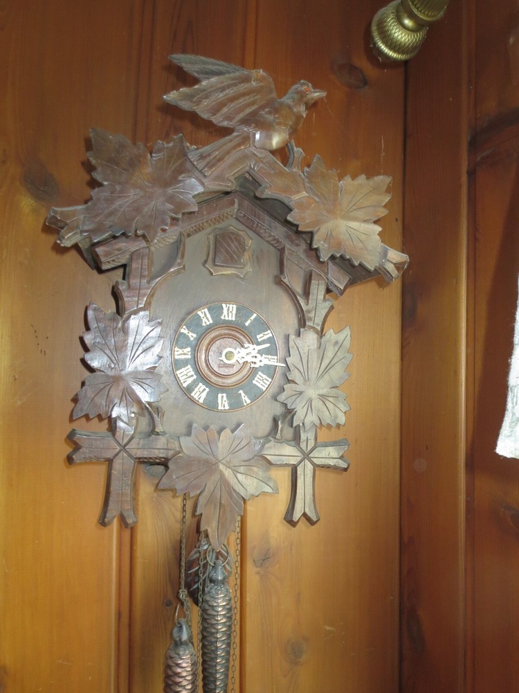 Old Cuckoo clock with articulated bird